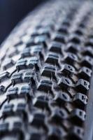 Bicycle wheel and tire close up on tread abstract. Macro