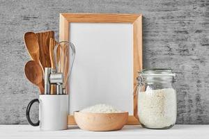 Kitchen utensils and white blank with copy space photo