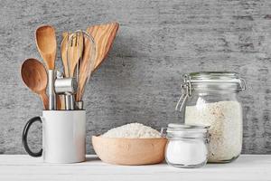 Kitchen utensils on gray wall photo