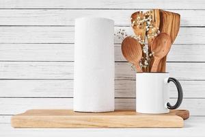 Kitchen tools and cutting board on white table photo