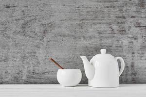 teapot and sugar bowl on gray background photo