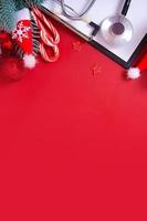 Medical Christmas New Year background with doctors stethoscope and XMAS decorations top view. Copy space photo