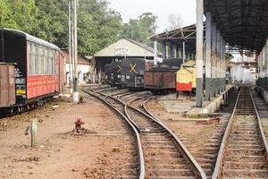 View of Toy train Railway Tracks from the middle during daytime near Kalka railway station in India, Toy train track view, Indian Railway junction, Heavy industry photo