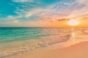 Sea ocean beach sunset sunrise landscape outdoor. Water wave with white foam. Beautiful sunset colorful sky with clouds. Natural island, sun rays seascape, dream nature. Inspirational shore, coast photo