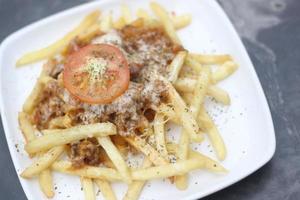 FRIED POTATOES WITH CHEESE TOPING photo