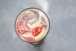 Strawberry mojito drink and a little fresh lemon photo