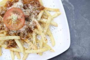 FRIED POTATOES WITH CHEESE TOPING photo
