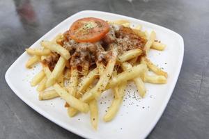 FRIED POTATOES WITH CHEESE TOPING photo