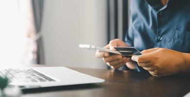 Woman hands of using online virtual app on mobile phone. Millennial guy chatting on smartphone, using banking services, reading text message, typing, shopping, making call, browsing internet.Close up photo