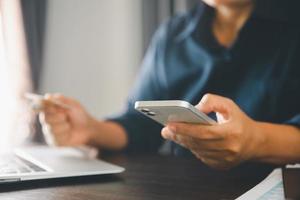 Woman hands of using online virtual app on mobile phone. Millennial guy chatting on smartphone, using banking services, reading text message, typing, shopping, making call, browsing internet.Close up photo