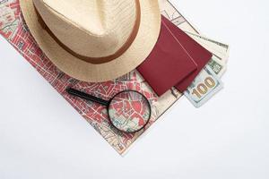traveler accessories with map, devices and clothes on white background photo
