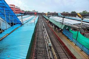 September 2021, Railway tracks foot over bridge and passenger trains at new delhi railway station photo