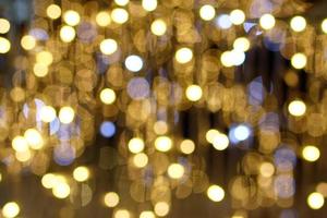 Blurred background in golden colors for New Year and Christmas theme with copy space. photo