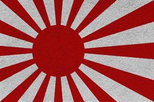 bandera imperial de la marina japonesa sobre un fondo texturizado. collage de conceptos foto