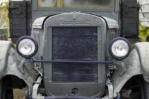 Soviet army truck Uralzis green camouflage. Retro truck, military vehicles. Front view of the logo and grille, hood and headlights. Ukraine, Kyiv - October 9, 2022. photo