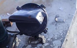 Element of the tank, a lantern for lighting. Front background lights of an army armored personnel carrier with protection. A powerful military searchlight mounted on the body of a combat vehicle. photo
