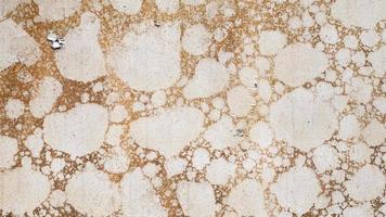 Texture of camouflage armored metal with damage close-up. Armor deformation from a shell close-up. Damaged armor of a Russian armored personnel carrier by shell fragments. War in Ukraine. photo