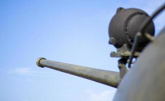 Tower of an armored personnel carrier or tank. Heavy weapons of war, sky background. Army equipment for combat and defense. Cannon tower. Details of military equipment. Close-up. photo