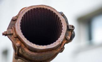 Tank gun, barrel muzzle of a military army close-up. Broken burnt tank. Barrel of a tank gun, selective focus. Destroyed and burned tank, military equipment in the vicinity of Kyiv. War in Ukraine. photo