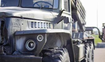 Soviet multiple launch rocket system BM-21 Grad on the chassis of a truck Ural-375D. Broken and burnt military equipment of the Russian Federation. Ural translation. Ukraine, Kyiv - October 8, 2022. photo