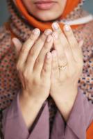 Close up of muslim women hand praying at ramadan photo
