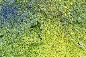 Texture of colorful graffiti paint on conrete and brick walls in red blue purple and silver photo