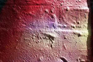 Texture of colorful graffiti paint on conrete and brick walls in red blue purple and silver photo