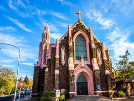 Old Corner Church With Steeple And Two Crosses photo