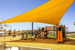 Children's Playground Equipment With Yellow Canopy photo