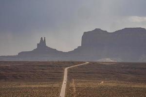 Aerial view of road leading towards Monument Valley with sky in background photo