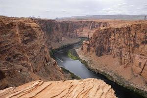 Scenic View Of Colorado River Flowing Amidst Mountains photo
