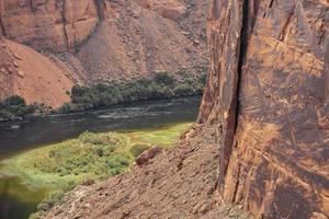 Colorado River Flowing Amidst Canyons At Glen Canyon Dam photo