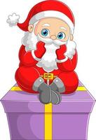 The cute santa claus is sitting and contemplating on the top of the big gift vector