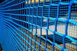 Mesh is double, large and small, blue, for safety on the playground. photo