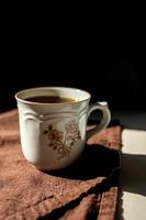 Coffee on white background with brown napkin photo
