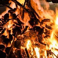 Fire flames on black background, Blaze fire flame texture background, Beautifully, the fire is burning, Fire flames with wood and cow dung bonfire photo