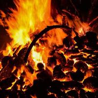 Fire flames on black background, Blaze fire flame texture background, Beautifully, the fire is burning, Fire flames with wood and cow dung bonfire photo