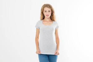 Young blonde woman with fit slim body in blank template t shirt and jeans isolated on white background. Skin and hair care. Copy space and mock up photo