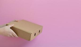 Fast and free Delivery.Close up hands holding cardboard boxes. copy space. Online shopping and Express delivery. photo