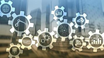 Automation technology and smart industry concept on blurred abstract background. Gears and icons. photo