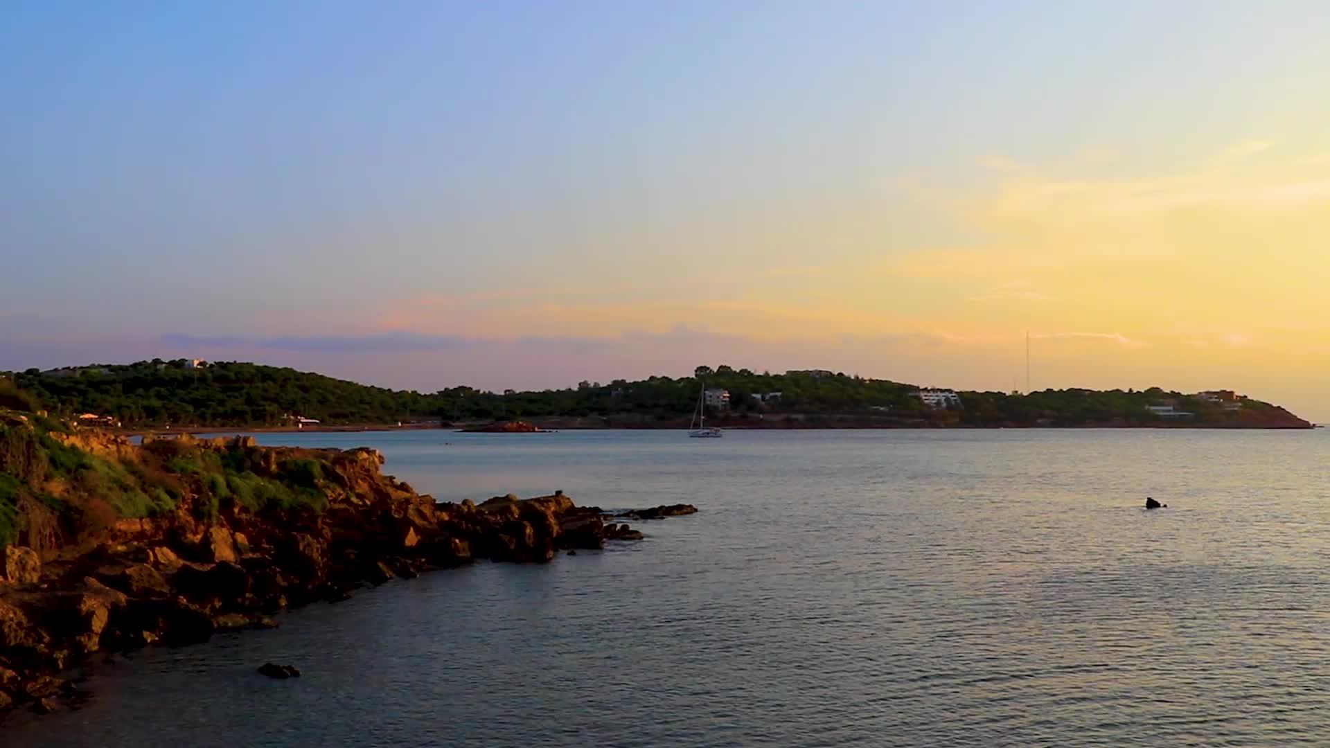 Incredibly beautiful colorful and golden sunset in Voula Vouliagmeni