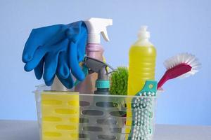 basket with cleaning products for home hygiene use photo