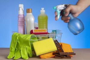 basket with cleaning products for home hygiene use photo