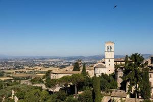 Church in Assisi village in Umbria region, Italy. The town is famous for the most important Italian Basilica dedicated to St. Francis - San Francesco. photo