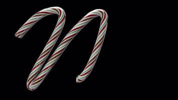 Glossy animated candy cane Christmas text typeface with alpha the character M video