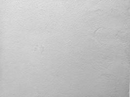 Paint white color on the Cement wall has gray color and rough abstract surface texture concrete material background photo