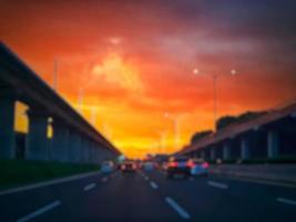 Defocused blurred abstract background of traffic jam at night in east Jakarta. The rear view, the red and yellow lights or the brake lights of the cars are on. photo