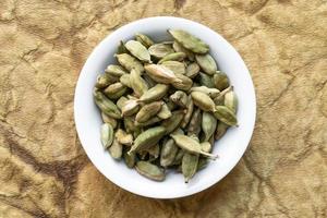 Green Cardamom Pods in a Bowl photo