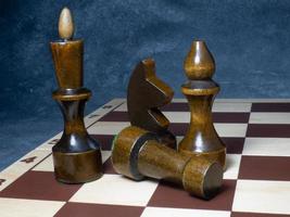 Chess board with figures. Wooden chess. Board games. Location of opponents. Counter strategy. photo