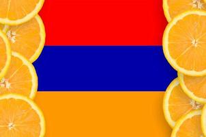 Armenia flag in citrus fruit slices vertical frame photo